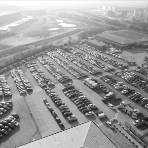 Monochrome Grid – Aerial View of Car Parking Logistics Hub