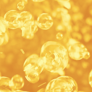 Golden Fizz – Close-Up of Bubbles in Carbonated Liquid