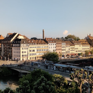 Golden Hour in Strasbourg – Riverside Tram and Historic Buildings