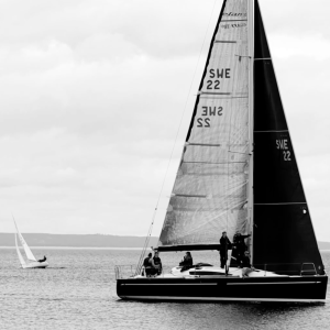 Monochrome Sail – Yacht Gliding on Calm Waters