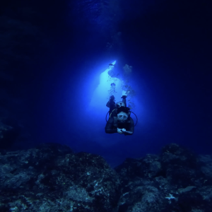Descent into the Deep – Scuba Diver in Underwater Cave